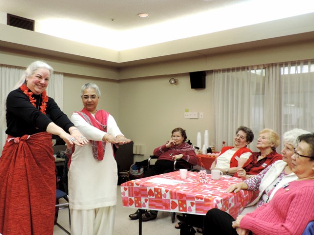 Lorraine teaches the Hula at the WHO meeting